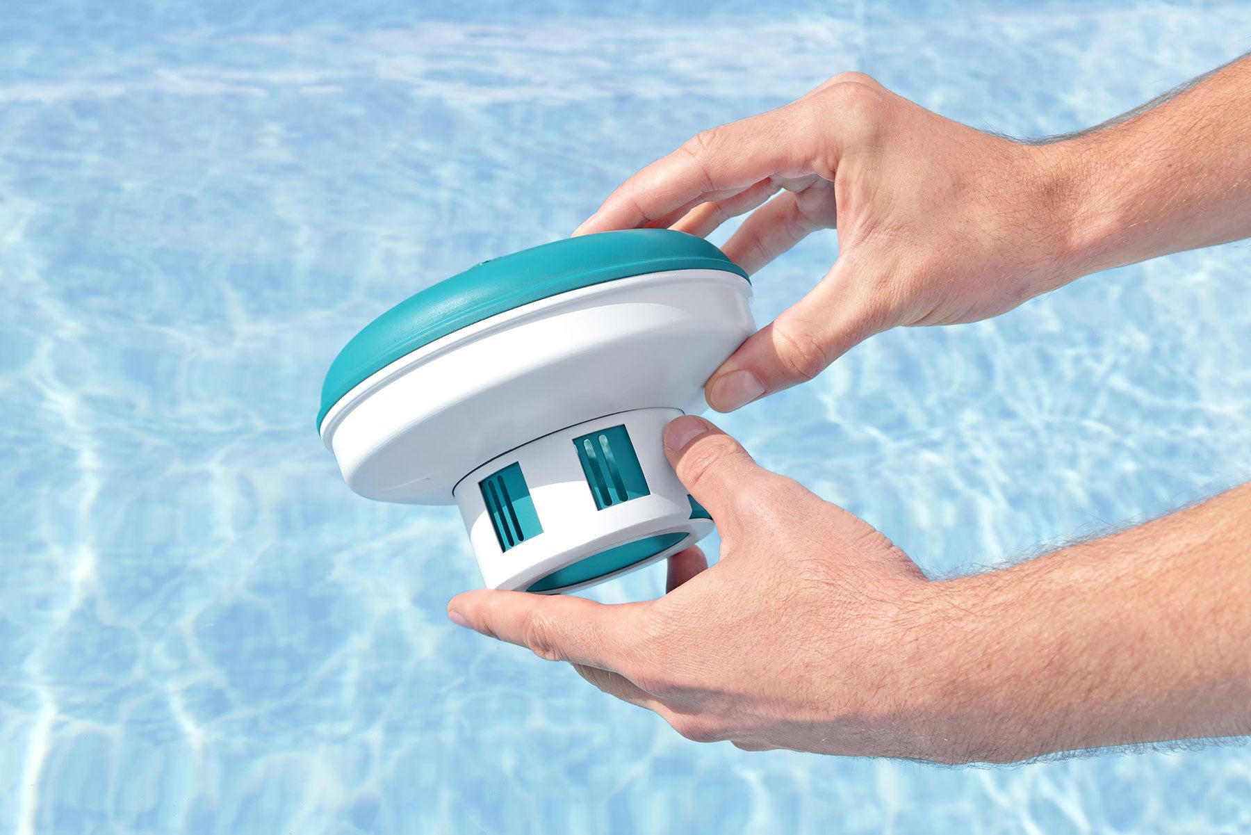 adjustable floating chemical dispenser