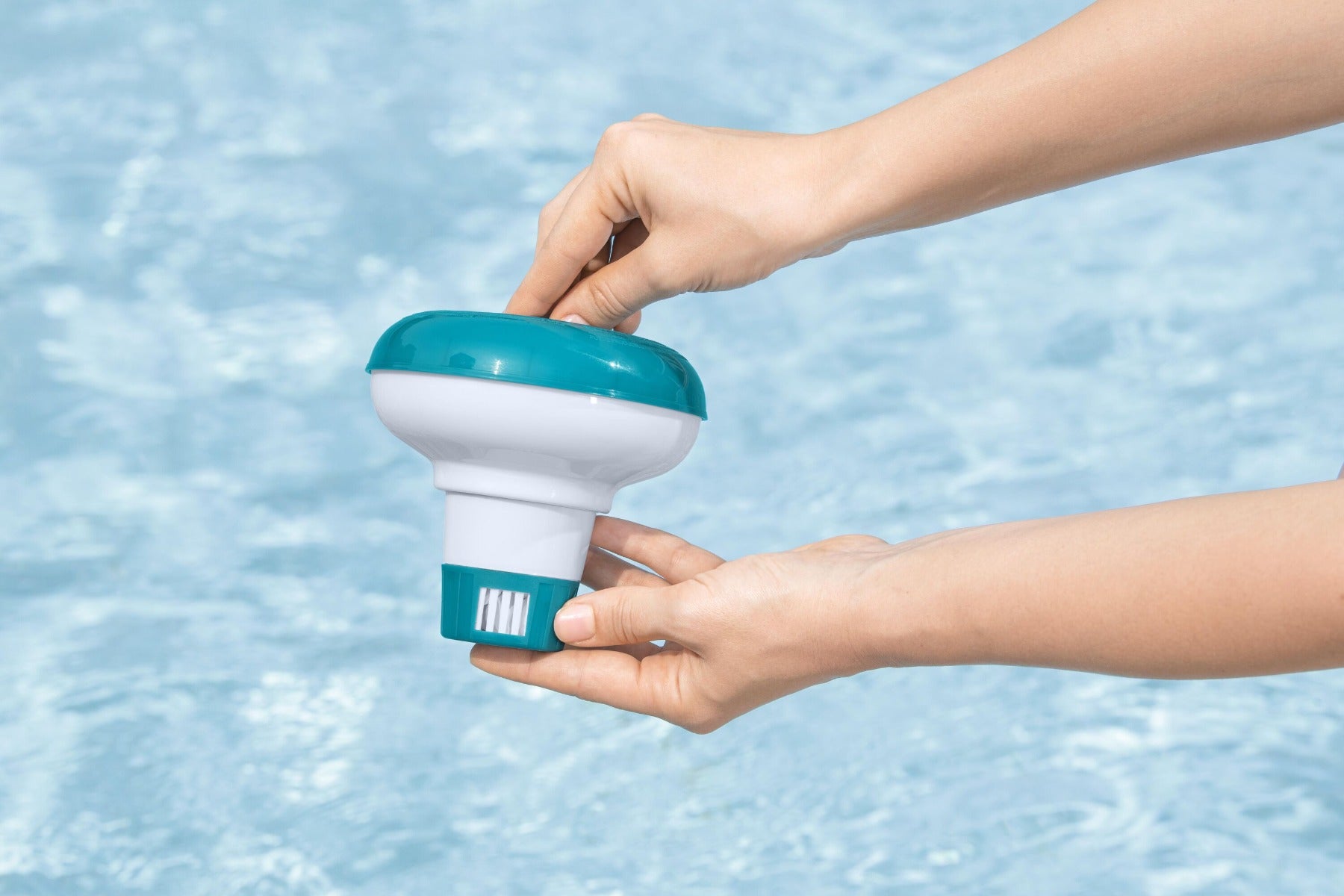 Adjustable floating dispenser for chlorine